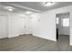 Spacious basement featuring gray floors, multiple entry and exit doors, and recessed lighting at 2174 Eleanor Dr, North Charleston, SC 29406