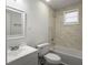 Charming bathroom featuring a bathtub, shower combo, and sleek white vanity at 2174 Eleanor Dr, North Charleston, SC 29406