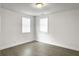 Bedroom with hardwood floors and natural light from two windows at 2174 Eleanor Dr, North Charleston, SC 29406