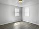 Comfortable bedroom featuring bright windows, white walls, recessed lighting, and hardwood-look floors at 2174 Eleanor Dr, North Charleston, SC 29406