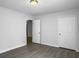 Comfortable bedroom with grey hardwood-look floors, bright recessed lighting, and a closet at 2174 Eleanor Dr, North Charleston, SC 29406