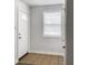 Bright entryway featuring a white door with sidelights, a window with blinds, and tile flooring at 2174 Eleanor Dr, North Charleston, SC 29406