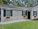 Charming house with stone accents, flower boxes, and manicured lawn at 2174 Eleanor Dr, North Charleston, SC 29406