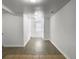 Long hallway featuring light gray floors, white walls, and recessed lights at 2174 Eleanor Dr, North Charleston, SC 29406
