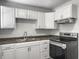 Bright kitchen with white cabinets, stainless steel appliances, and modern countertops at 2174 Eleanor Dr, North Charleston, SC 29406
