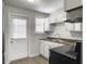 Cozy kitchen featuring white cabinets, stainless steel appliances, and bright windows at 2174 Eleanor Dr, North Charleston, SC 29406