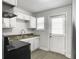 Well-lit kitchen featuring white cabinets, modern countertops, and stainless steel appliances at 2174 Eleanor Dr, North Charleston, SC 29406