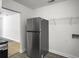 A stainless steel refrigerator and washer hookups in the kitchen at 2174 Eleanor Dr, North Charleston, SC 29406