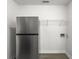 Stainless steel refrigerator, washer hookups, and wire shelving in the kitchen at 2174 Eleanor Dr, North Charleston, SC 29406