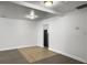 Bright living room featuring light gray floors, white walls, recessed lights, and a kitchen entrance at 2174 Eleanor Dr, North Charleston, SC 29406