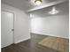 Bright living room featuring light gray floors, white walls, recessed lights, and an interior door at 2174 Eleanor Dr, North Charleston, SC 29406