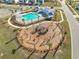 Aerial view of the community playground and pool area, including lush landscaping at 224 Wappoo Trace Ln, Summerville, SC 29486