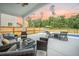 Relaxing backyard with an in-ground pool, seating area, fence and lush greenery at 224 Wappoo Trace Ln, Summerville, SC 29486
