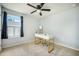 Bright bedroom featuring a ceiling fan, natural light, and desk for a workspace at 224 Wappoo Trace Ln, Summerville, SC 29486