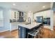 Well-equipped kitchen featuring a center island, white cabinets, and modern appliances at 224 Wappoo Trace Ln, Summerville, SC 29486