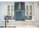 Kitchen features white cabinets and a stainless steel range hood at 224 Wappoo Trace Ln, Summerville, SC 29486