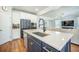Open concept kitchen with stainless steel appliances and large island at 224 Wappoo Trace Ln, Summerville, SC 29486