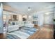 Open concept living area with a large sectional sofa and stylish decor at 224 Wappoo Trace Ln, Summerville, SC 29486