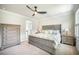 Serene main bedroom featuring a spacious bed, carpet, modern ceiling fan, and natural light from shuttered windows at 224 Wappoo Trace Ln, Summerville, SC 29486