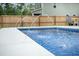 Backyard swimming pool with water features, modern design and a concrete patio at 224 Wappoo Trace Ln, Summerville, SC 29486