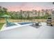 Inviting in-ground pool with lounge chairs and a seating area, perfect for summer relaxation at 224 Wappoo Trace Ln, Summerville, SC 29486