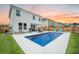 Backyard with an in-ground pool, patio seating, and a manicured lawn with a privacy fence at 224 Wappoo Trace Ln, Summerville, SC 29486