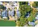 A picturesque aerial view of homes neighboring a tranquil community lake and lush landscaping at 2257 Magnolia Meadows Dr, Mount Pleasant, SC 29464