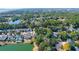 Aerial view of luxurious homes nestled within lush greenery, creating a serene lakeside community at 2257 Magnolia Meadows Dr, Mount Pleasant, SC 29464