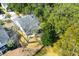 An aerial view shows a well-maintained home nestled among mature trees in a desirable neighborhood at 2257 Magnolia Meadows Dr, Mount Pleasant, SC 29464