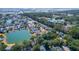 An aerial view of a neighborhood with beautiful homes surrounding a picturesque body of water at 2257 Magnolia Meadows Dr, Mount Pleasant, SC 29464