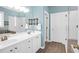Bathroom featuring dual sinks, a walk-in shower, and a soaking tub at 2257 Magnolia Meadows Dr, Mount Pleasant, SC 29464