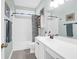 Bathroom featuring a white vanity with bronze fixtures, shower-tub combo, and light aqua paint at 2257 Magnolia Meadows Dr, Mount Pleasant, SC 29464