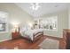 Bright bedroom with hardwood floors, white bedding, and natural light at 2257 Magnolia Meadows Dr, Mount Pleasant, SC 29464