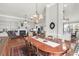 Large dining table with seating for eight and views of the living room at 2257 Magnolia Meadows Dr, Mount Pleasant, SC 29464