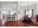 Dining area featuring hardwood floors, chandelier, and a cozy atmosphere at 2257 Magnolia Meadows Dr, Mount Pleasant, SC 29464
