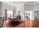 Traditional dining room features hardwood floors, area rug, and detailed molding at 2257 Magnolia Meadows Dr, Mount Pleasant, SC 29464