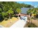 Attractive brick home boasts palm trees and a convenient two-car garage at 2257 Magnolia Meadows Dr, Mount Pleasant, SC 29464
