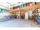 Spacious garage featuring storage solutions, including overhead racks, shelving units, and bike storage at 2257 Magnolia Meadows Dr, Mount Pleasant, SC 29464
