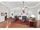 Comfortable living room featuring a fireplace, ceiling fan, and hardwood floors at 2257 Magnolia Meadows Dr, Mount Pleasant, SC 29464