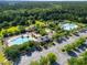 Aerial shot of community amenities featuring swimming pools, recreational areas, and a parking lot at 2293 Beckenham Dr, Mount Pleasant, SC 29466