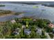 A high-angle showcases 2293 Beckenham Dr near the Wando River surrounded by lush trees at 2293 Beckenham Dr, Mount Pleasant, SC 29466