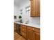 A beverage bar features white marble countertops and custom wood cabinetry at 2293 Beckenham Dr, Mount Pleasant, SC 29466