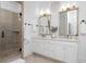 A stylish bathroom features double sinks and a walk-in shower at 2293 Beckenham Dr, Mount Pleasant, SC 29466