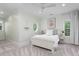 Bright bedroom features a white bed, carpeted floor and oval window at 2293 Beckenham Dr, Mount Pleasant, SC 29466