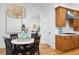 Cozy breakfast nook with a round table, four chairs, and a stylish pendant light at 2293 Beckenham Dr, Mount Pleasant, SC 29466