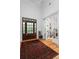 Elegant foyer showcasing hardwood floors, paneled doors and a glimpse into adjacent living spaces at 2293 Beckenham Dr, Mount Pleasant, SC 29466