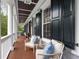Inviting porch featuring comfortable seating, blue cushions and classic white columns at 2293 Beckenham Dr, Mount Pleasant, SC 29466