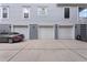 Spacious three-car garage with ample parking space and a gray car parked outside at 2293 Beckenham Dr, Mount Pleasant, SC 29466