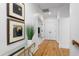 A hallway decorated with art pieces provides access to all rooms of the home at 2293 Beckenham Dr, Mount Pleasant, SC 29466