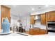 Well-equipped kitchen with wooden cabinets, stainless steel appliances, and a breakfast nook at 2293 Beckenham Dr, Mount Pleasant, SC 29466
